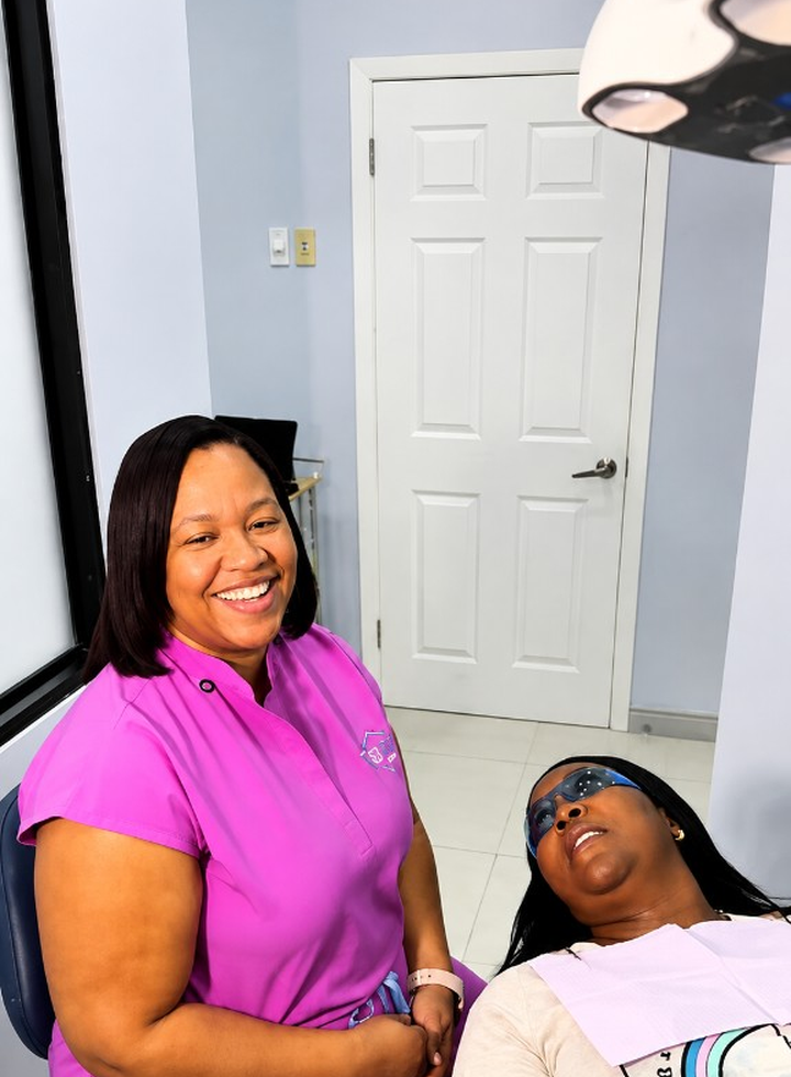 The Smile Club clinic team with a patient